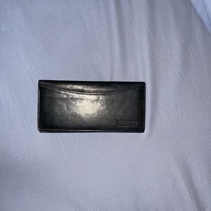 Wilson’s genuine black leather check book.